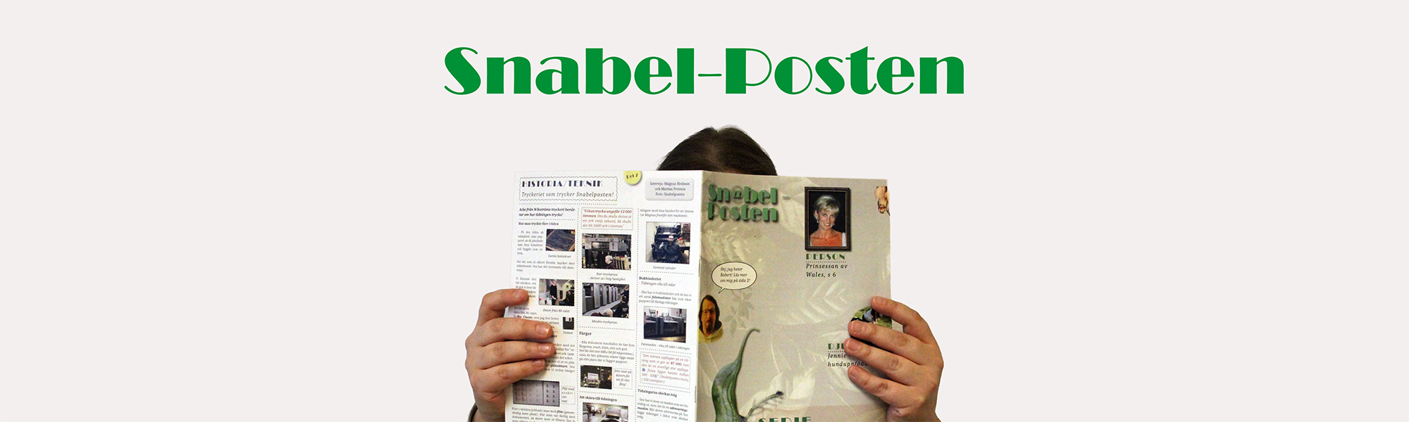 En person bakom en tidning